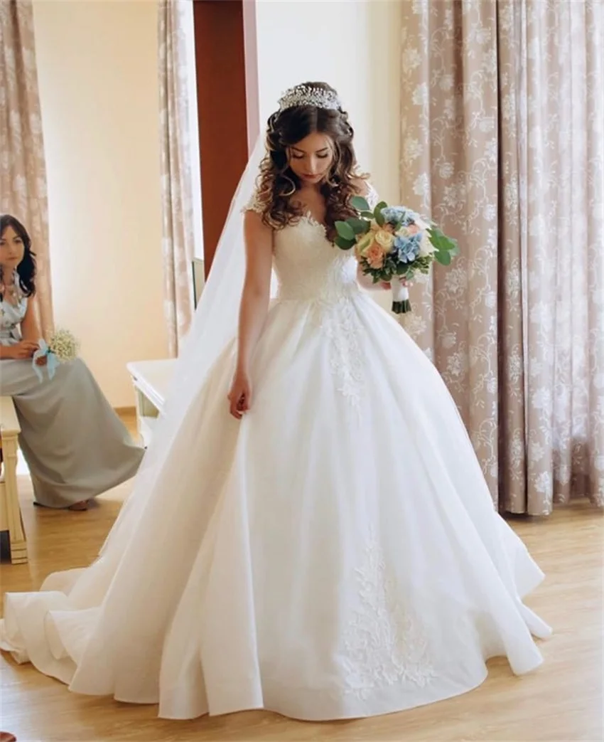 Gorgeous Princess Wedding Dresses O-neck Appliqued Puffy Ball Gown Sleeveless Bridal Dresses White Ivory Wedding Gowns 2020
Gorgeous Princess Wedding Dresses O-neck Appliqued Puffy Ball Gown Sleeveless Bridal Dresses White Ivory Wedding Gowns 2020