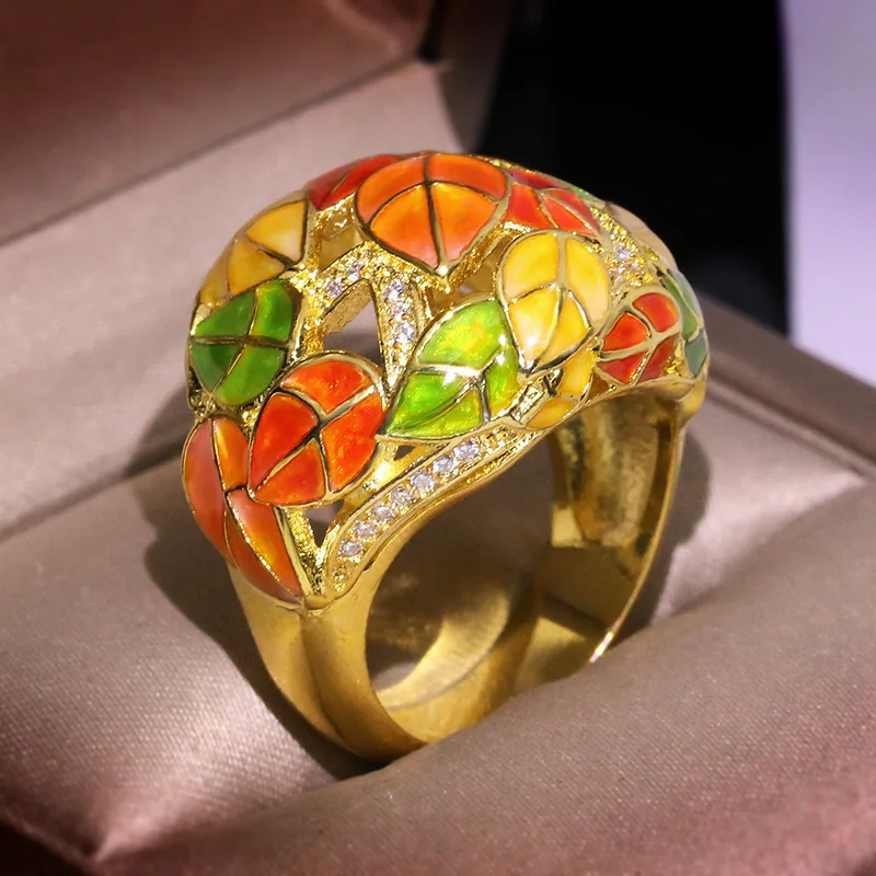NPKDS Creative Yellow Gold Color Ring Female Retro Colorful Enamel Ring Exaggerated Flower Leaf Ring High Quality
NPKDS Creative Yellow Gold Color Ring Female Retro Colorful Enamel Ring Exaggerated Flower Leaf Ring High Quality