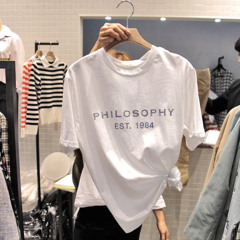 Женская хлопковая футболка с коротким рукавом, белая свободная футболка с принтом позолоченных букв, лето 2021
Женская хлопковая футболка с коротким рукавом, белая свободная футболка с принтом позолоченных букв, лето 2021