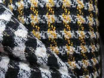 free ship polyester and wool tweed fabric ginger with black and white houndstooth 59" wide 
free ship polyester and wool tweed fabric ginger with black and white houndstooth 59" wide