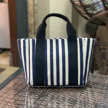 Fashion stripe women's shoulder bag Korean canvas sling bag small square cross handbag Mini simple travel handbag
Fashion stripe women's shoulder bag Korean canvas sling bag small square cross handbag Mini simple travel handbag