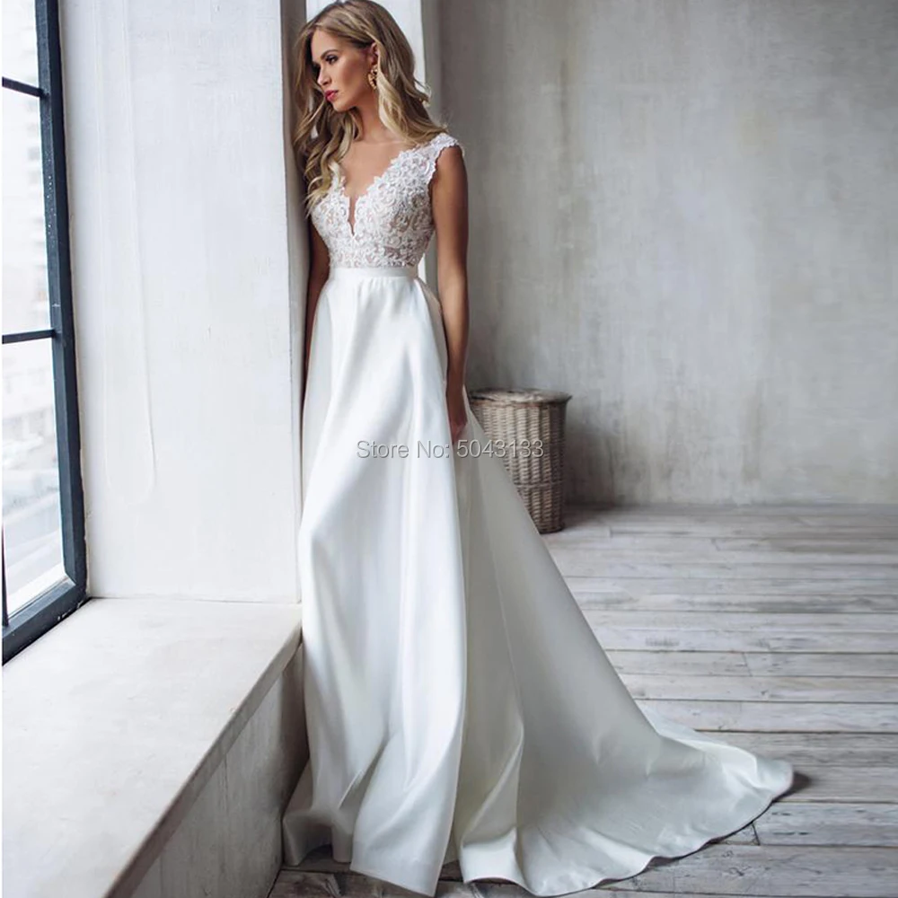 A Line Satin Wedding Dresses 2019 Lace Appliques V Neck Sleeveless Wedding Gowns Court Train Backless Bride Dress
A Line Satin Wedding Dresses 2019 Lace Appliques V Neck Sleeveless Wedding Gowns Court Train Backless Bride Dress
