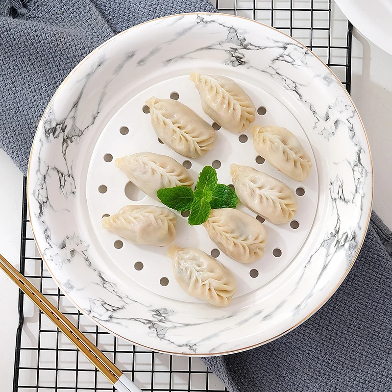 Guci Nordic 10INCH Phnom Penh Dumpling Plate Double-deck Drainage Large Steamed Plate Steamed Fish Deep Plate Household Round
Guci Nordic 10INCH Phnom Penh Dumpling Plate Double-deck Drainage Large Steamed Plate Steamed Fish Deep Plate Household Round