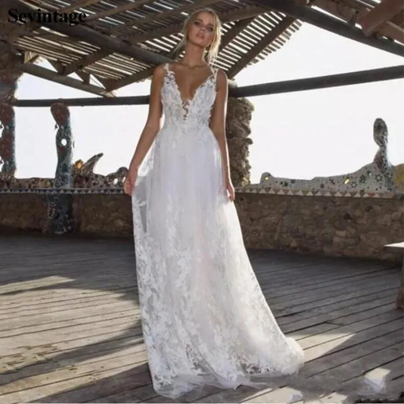 Sevintage Newest V-Neck Boho Wedding Dress Sleeveless Backless Appliques Lace Bridal Gowns Tulle Court Train Bride Gown Princess
Sevintage Newest V-Neck Boho Wedding Dress Sleeveless Backless Appliques Lace Bridal Gowns Tulle Court Train Bride Gown Princess