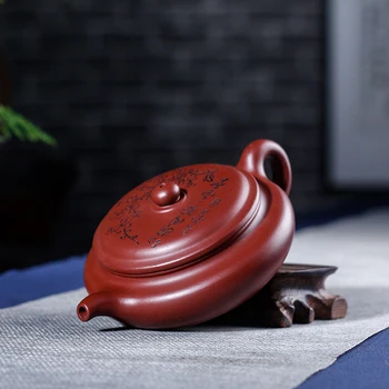 Yixing recommended undressed ore dahongpao carved painting plum blossoms flat archaize pot of 180 ml 
Yixing recommended undressed ore dahongpao carved painting plum blossoms flat archaize pot of 180 ml