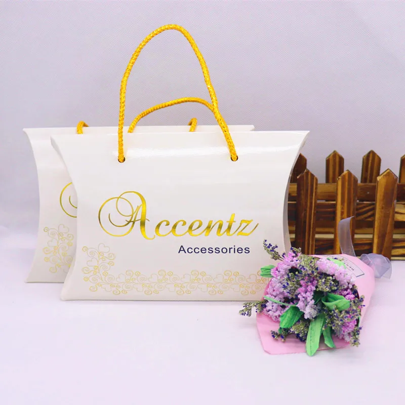 Custom logo paper pillow gift hanger box white background gold foil gift box pillow shape with gold string custom logo 1000pcs
Custom logo paper pillow gift hanger box white background gold foil gift box pillow shape with gold string custom logo 1000pcs