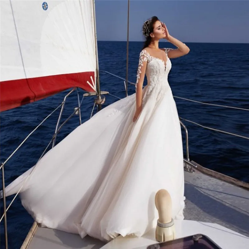 Illusion Long Sleeves Lace Appliques Wedding Gowns Buttons See Through Back Tulle Beach Bridal Dress Spring Ladies Long Spring
Illusion Long Sleeves Lace Appliques Wedding Gowns Buttons See Through Back Tulle Beach Bridal Dress Spring Ladies Long Spring