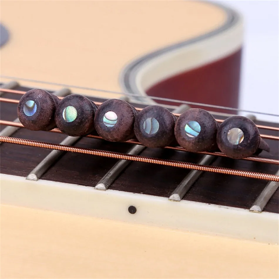 6PCS Six-string Acoustic Guitar Bone Bridge Foot Pin Embedded Abalone Point Nail Puller Guitar Parts
6PCS Six-string Acoustic Guitar Bone Bridge Foot Pin Embedded Abalone Point Nail Puller Guitar Parts