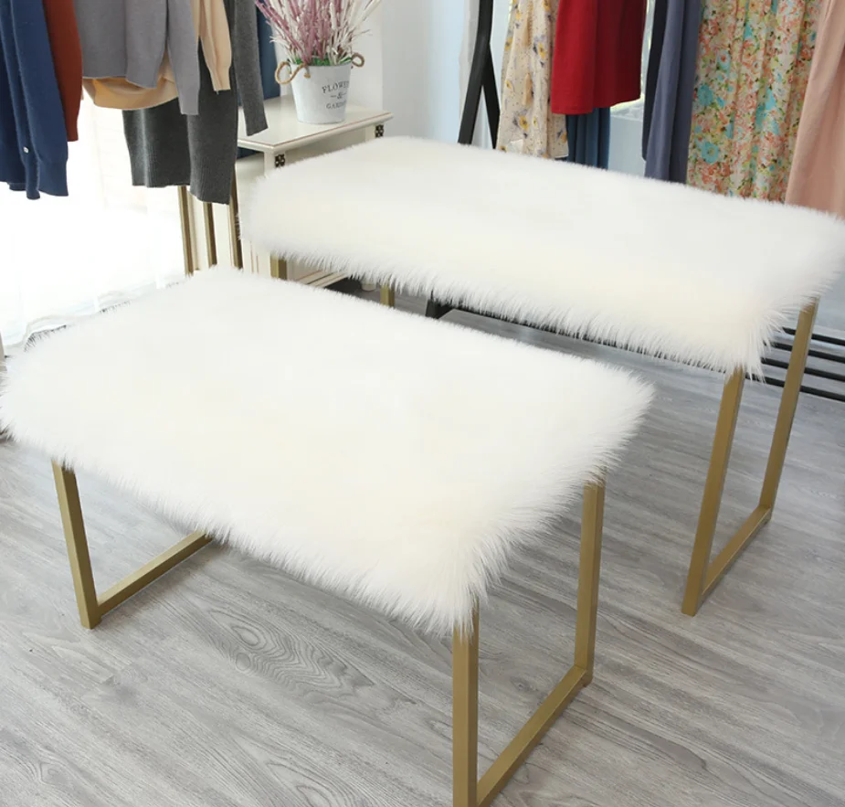 Plush Faux Fur table top laid with rectangular fluffy cushion items placed fluffy covered table blanket
Plush Faux Fur table top laid with rectangular fluffy cushion items placed fluffy covered table blanket