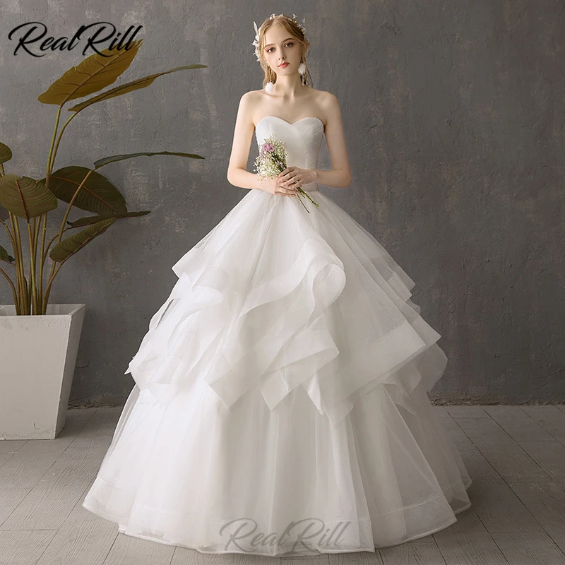 Real Rill White Sweetheart Wedding Dress Lace Up Back Ruffle Tulle Floor Length Strapless Bride Dress Wedding Gowns 
Real Rill White Sweetheart Wedding Dress Lace Up Back Ruffle Tulle Floor Length Strapless Bride Dress Wedding Gowns