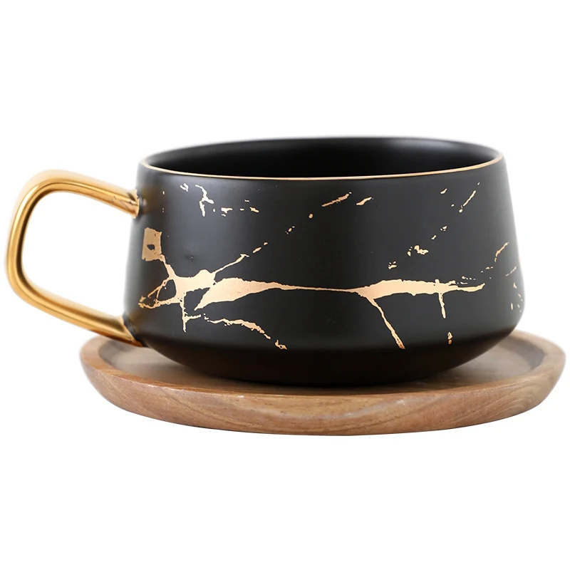 300ml Luxury matte ceramic marble tea coffee Cups and with wood Saucers black and white gold inlay ceramic cups
300ml Luxury matte ceramic marble tea coffee Cups and with wood Saucers black and white gold inlay ceramic cups