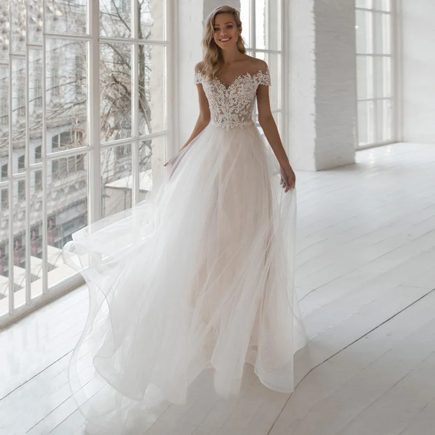A-line Bohemian Wedding Dresses Vestido De Noiva Short Sleeves Pearls Beads Applique Tulle Wedding Gowns Sheer O-Neck Elegant
A-line Bohemian Wedding Dresses Vestido De Noiva Short Sleeves Pearls Beads Applique Tulle Wedding Gowns Sheer O-Neck Elegant