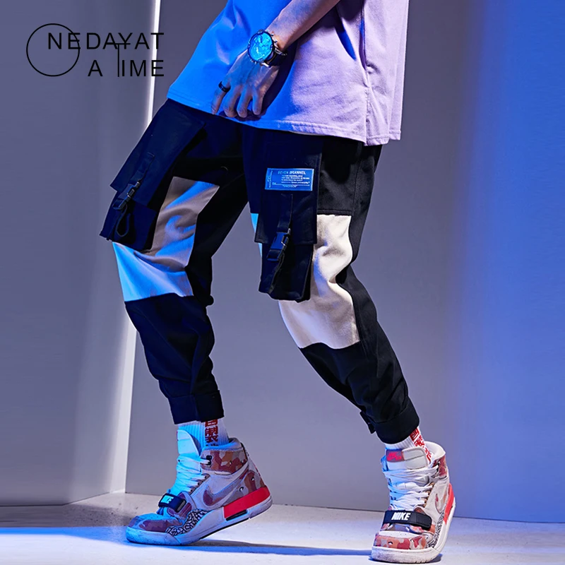 Hip Hop Cargo Pant Streetwear Men Baggy Harem Pant Patchwork Multi Pocket Trousers Casual Tatical Pant Swag Ribbon Harajuku 2019
Hip Hop Cargo Pant Streetwear Men Baggy Harem Pant Patchwork Multi Pocket Trousers Casual Tatical Pant Swag Ribbon Harajuku 2019