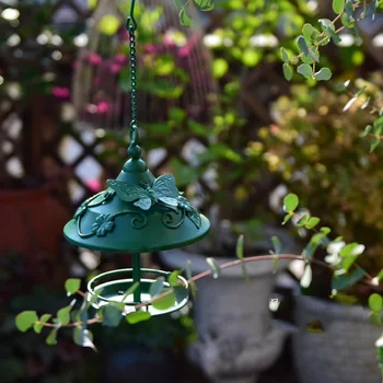 green small metal bird feeder
green small metal bird feeder