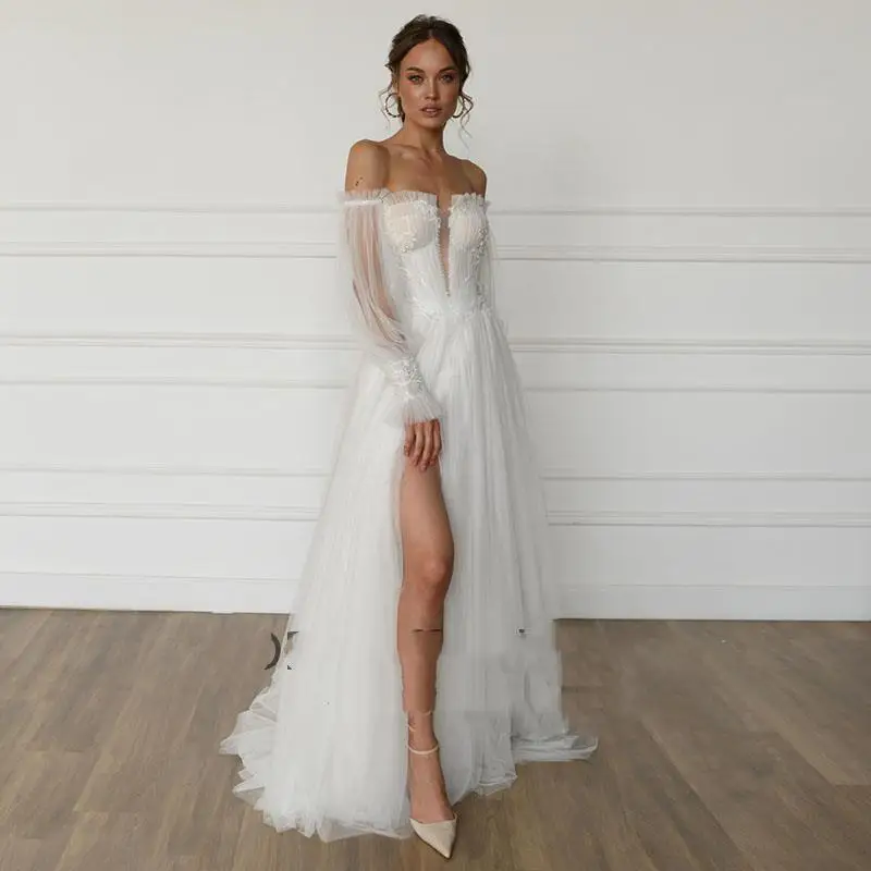 Vintage Wedding Dresses Appliques with Detachable Puff Long Sleeves Wedding Beaded Bridal Gown vestido de novia playero 
Vintage Wedding Dresses Appliques with Detachable Puff Long Sleeves Wedding Beaded Bridal Gown vestido de novia playero