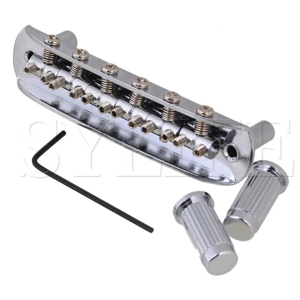 Хромированный роликовый мост Tune-O-Matic для гитары с 6 струнами и монтажным расстоянием 74 мм
Хромированный роликовый мост Tune-O-Matic для гитары с 6 струнами и монтажным расстоянием 74 мм