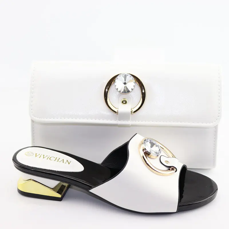 Fashion nice white color italian shoes and bag matching set for african aso ebi wedding party low heel slippers and bag SB8415-1
Fashion nice white color italian shoes and bag matching set for african aso ebi wedding party low heel slippers and bag SB8415-1