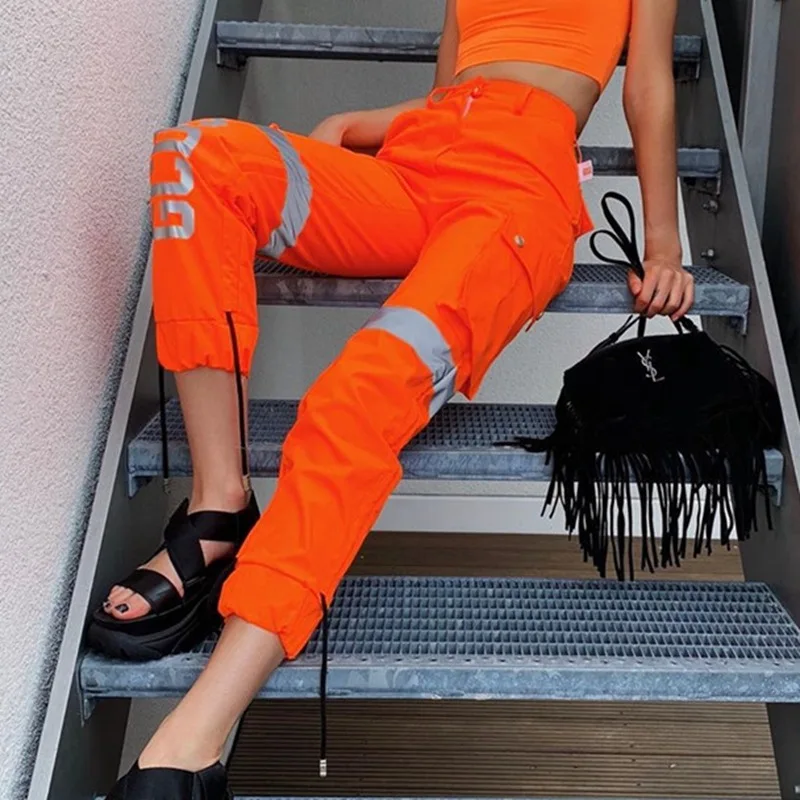 High Street Neon Orange Reflective Joggers Women High Waist Cargo Pants with Reflective Letters Ladies Shiny Orange Trousers
High Street Neon Orange Reflective Joggers Women High Waist Cargo Pants with Reflective Letters Ladies Shiny Orange Trousers