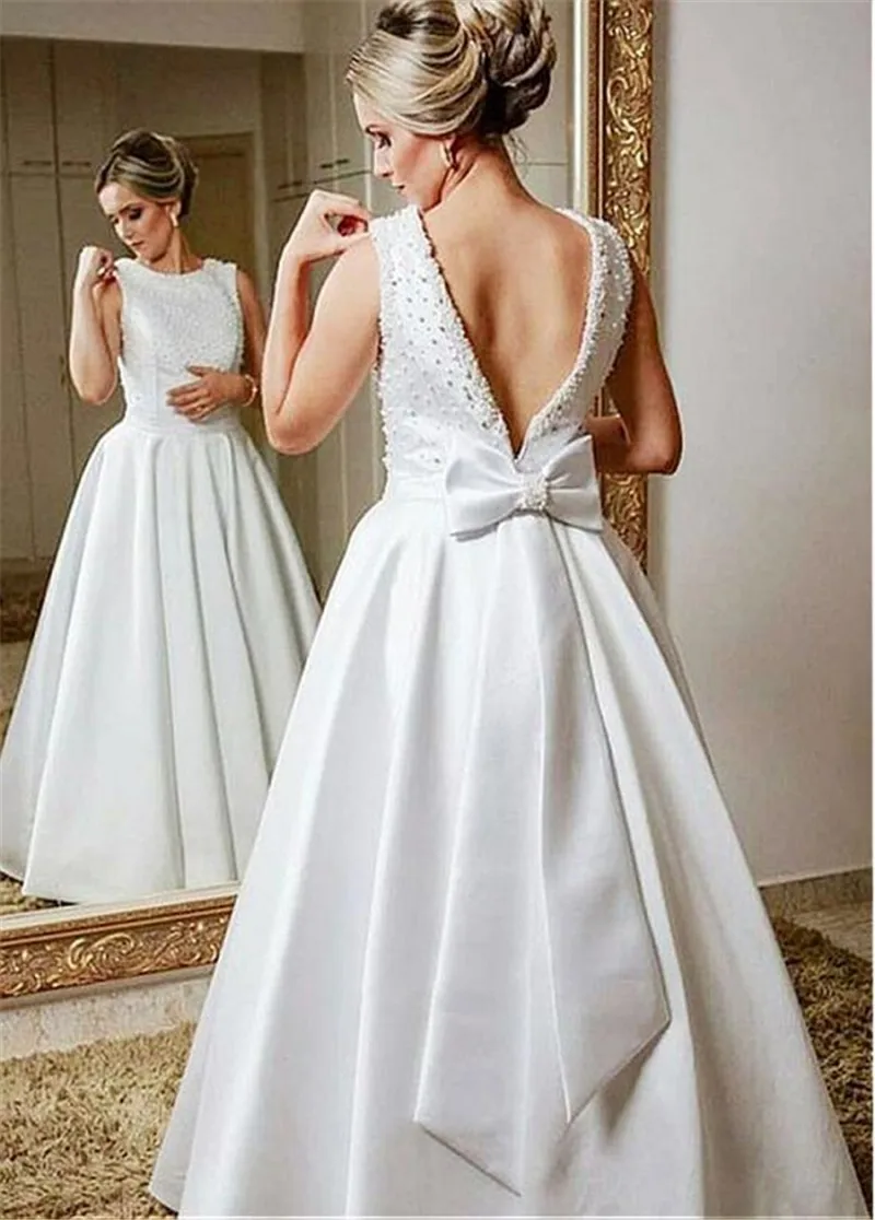 Modest Satin Scoop Satin A-line Wedding Dress With Pearls Sleeveless Hand Made Bow Backless Bridal Gown vestido madrinha
Modest Satin Scoop Satin A-line Wedding Dress With Pearls Sleeveless Hand Made Bow Backless Bridal Gown vestido madrinha
