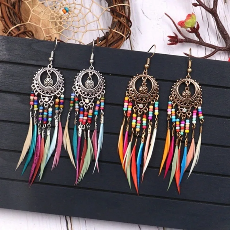 2019 Bohemian Retro Hollow Oval Colorful Beads Feather Tassel Earrings European And American Personality Exaggerated Jewelery
2019 Bohemian Retro Hollow Oval Colorful Beads Feather Tassel Earrings European And American Personality Exaggerated Jewelery