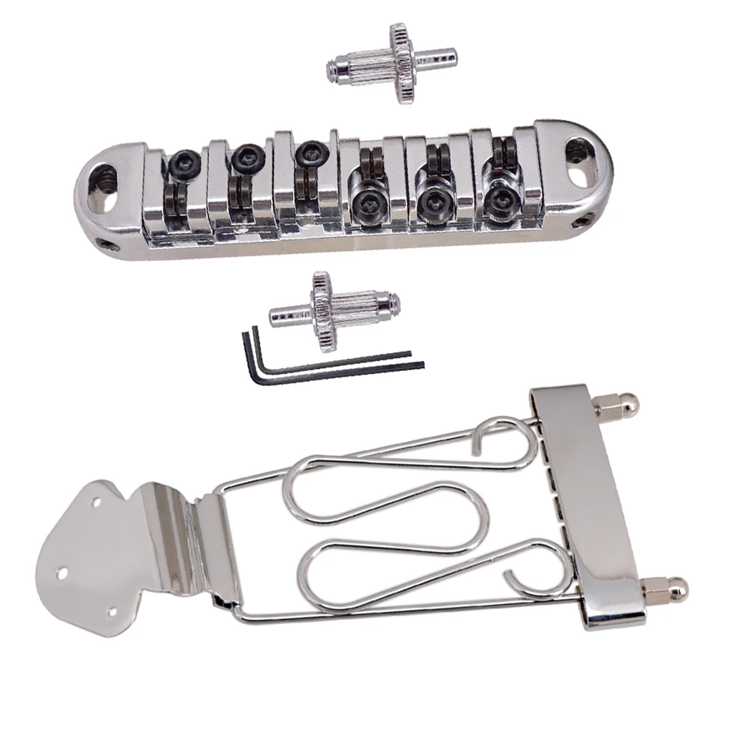 6 String Guitar Trapeze Tailpiece Bridge with Roller Saddle Bridge, Lock Posts and Wrench for Jazz Archtop Guitar
6 String Guitar Trapeze Tailpiece Bridge with Roller Saddle Bridge, Lock Posts and Wrench for Jazz Archtop Guitar