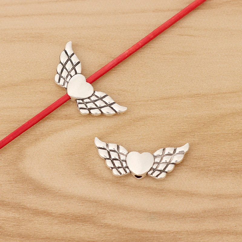 50 Pieces Tibetan Silver/Gold Color Angel Wing Heart Spacer Beads Charms for DIY Jewellery Making Findings Accessories 22x9mm
50 Pieces Tibetan Silver/Gold Color Angel Wing Heart Spacer Beads Charms for DIY Jewellery Making Findings Accessories 22x9mm