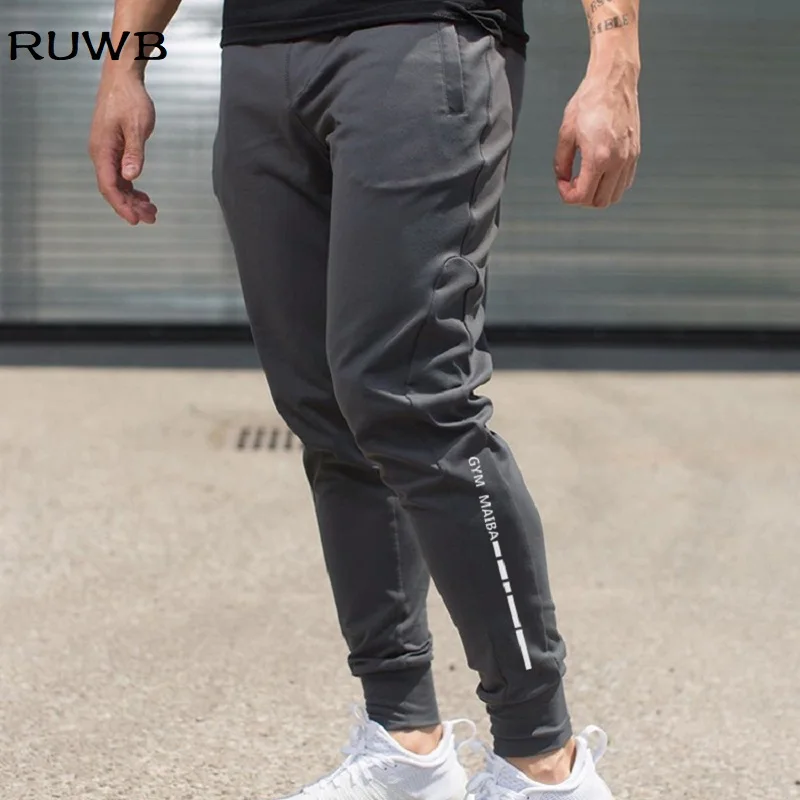 Fitness Men Joggers Sweatpants Letter Printed Sportswear Jogger Pants Men Casual Trousers Men Gyms Bodybuilding Track Pants
Fitness Men Joggers Sweatpants Letter Printed Sportswear Jogger Pants Men Casual Trousers Men Gyms Bodybuilding Track Pants