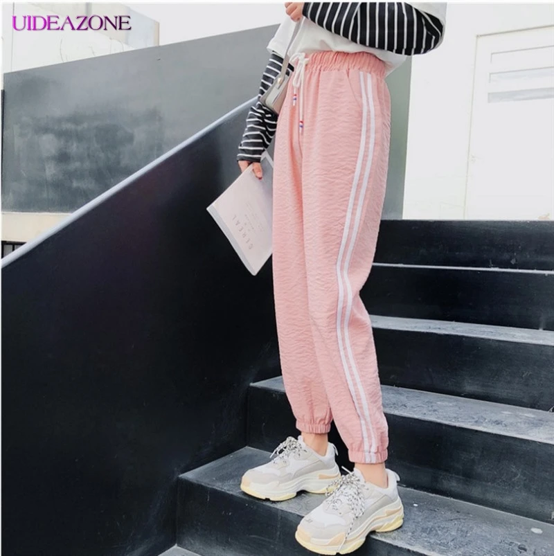 UIDEAZONE Fashion Casual Sports Pants Women Sweatpants Female Side Lines Elastic Waist Trousers Fitness Harem Pants Plus Size
UIDEAZONE Fashion Casual Sports Pants Women Sweatpants Female Side Lines Elastic Waist Trousers Fitness Harem Pants Plus Size