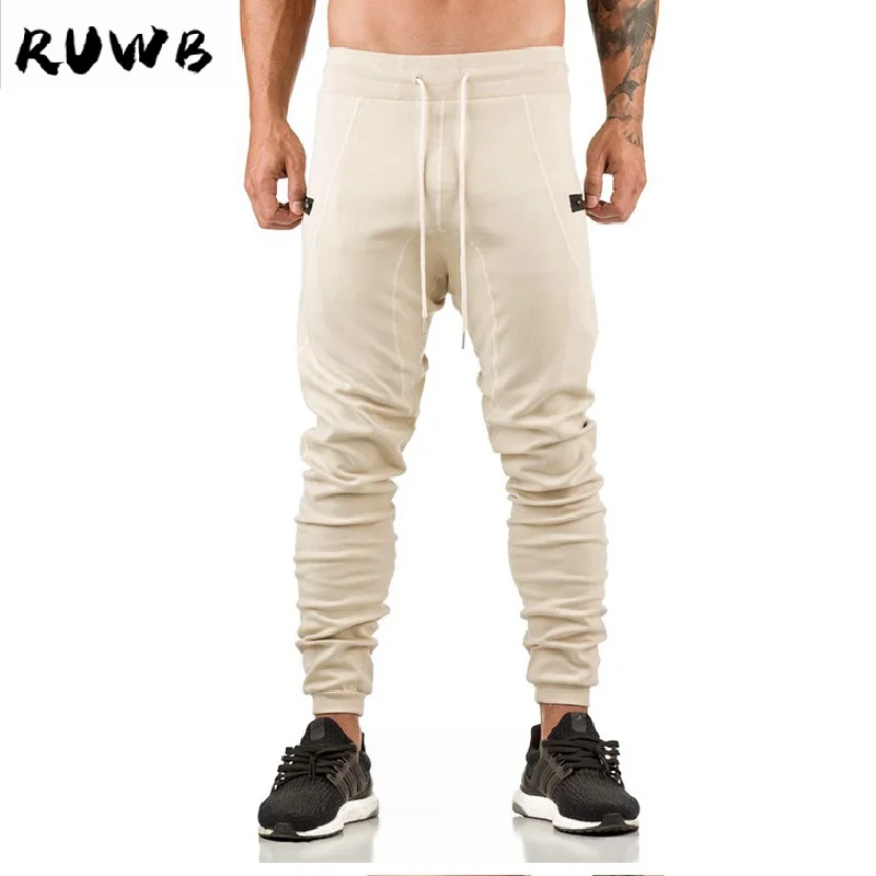 Autumn Men Full Sportswear Pants Casual Elastic Gym Mens Fitness Workout Pants Skinny Sweatpants Trousers Jogger Pants
Autumn Men Full Sportswear Pants Casual Elastic Gym Mens Fitness Workout Pants Skinny Sweatpants Trousers Jogger Pants