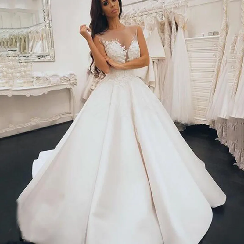 New Wedding Dresses 2020 A-line O Neck Bridal Gown Lace Appliques Ball Gown Sleeveless Vestidos de Noivas Floor Length
New Wedding Dresses 2020 A-line O Neck Bridal Gown Lace Appliques Ball Gown Sleeveless Vestidos de Noivas Floor Length