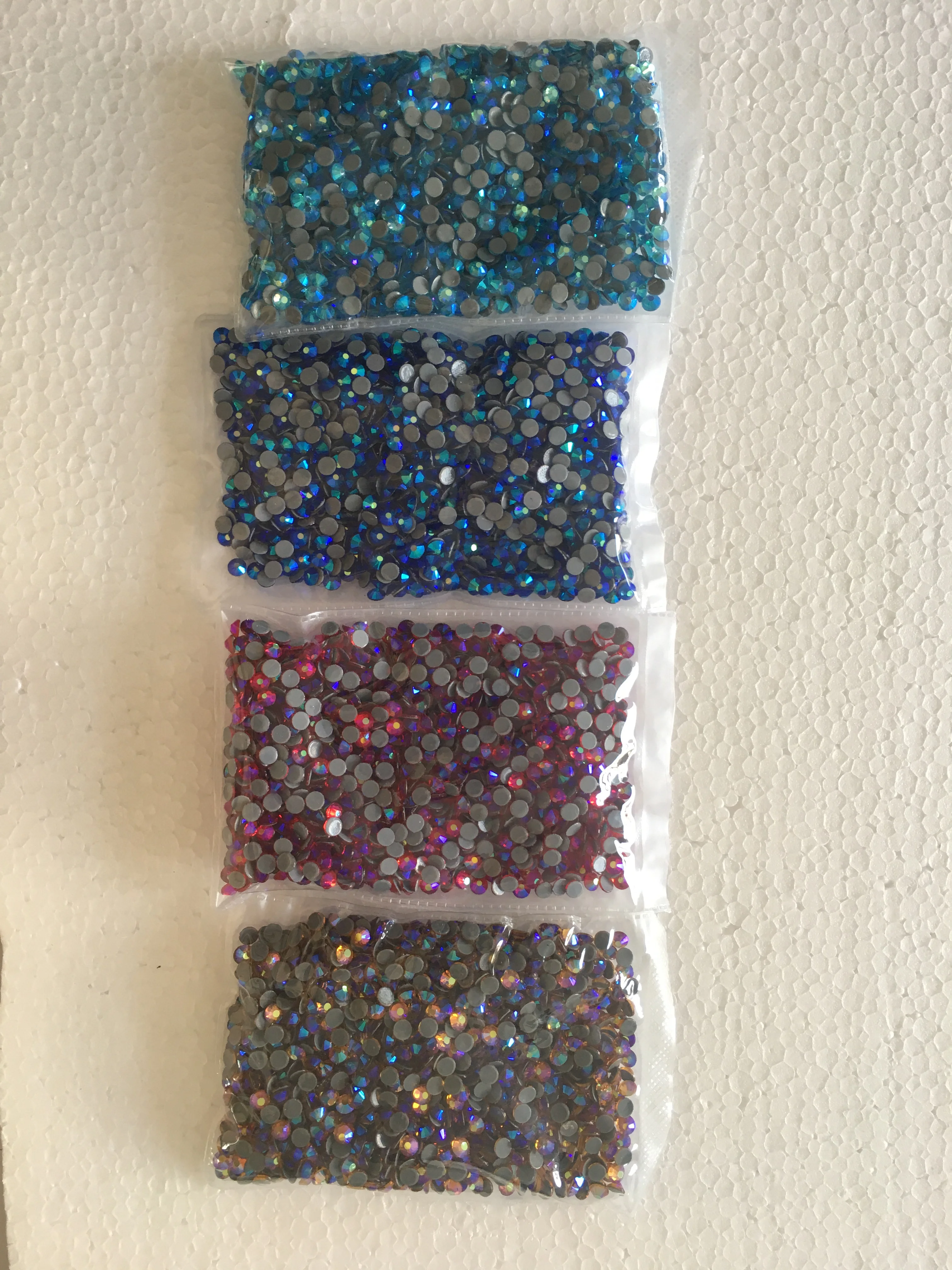 Various AB Color High Quality Hot fix Rhinestones Sapphire AB Siam AB Aquamarine Dark AB Gold AB Iron on Wedding Dress Cloth
Various AB Color High Quality Hot fix Rhinestones Sapphire AB Siam AB Aquamarine Dark AB Gold AB Iron on Wedding Dress Cloth