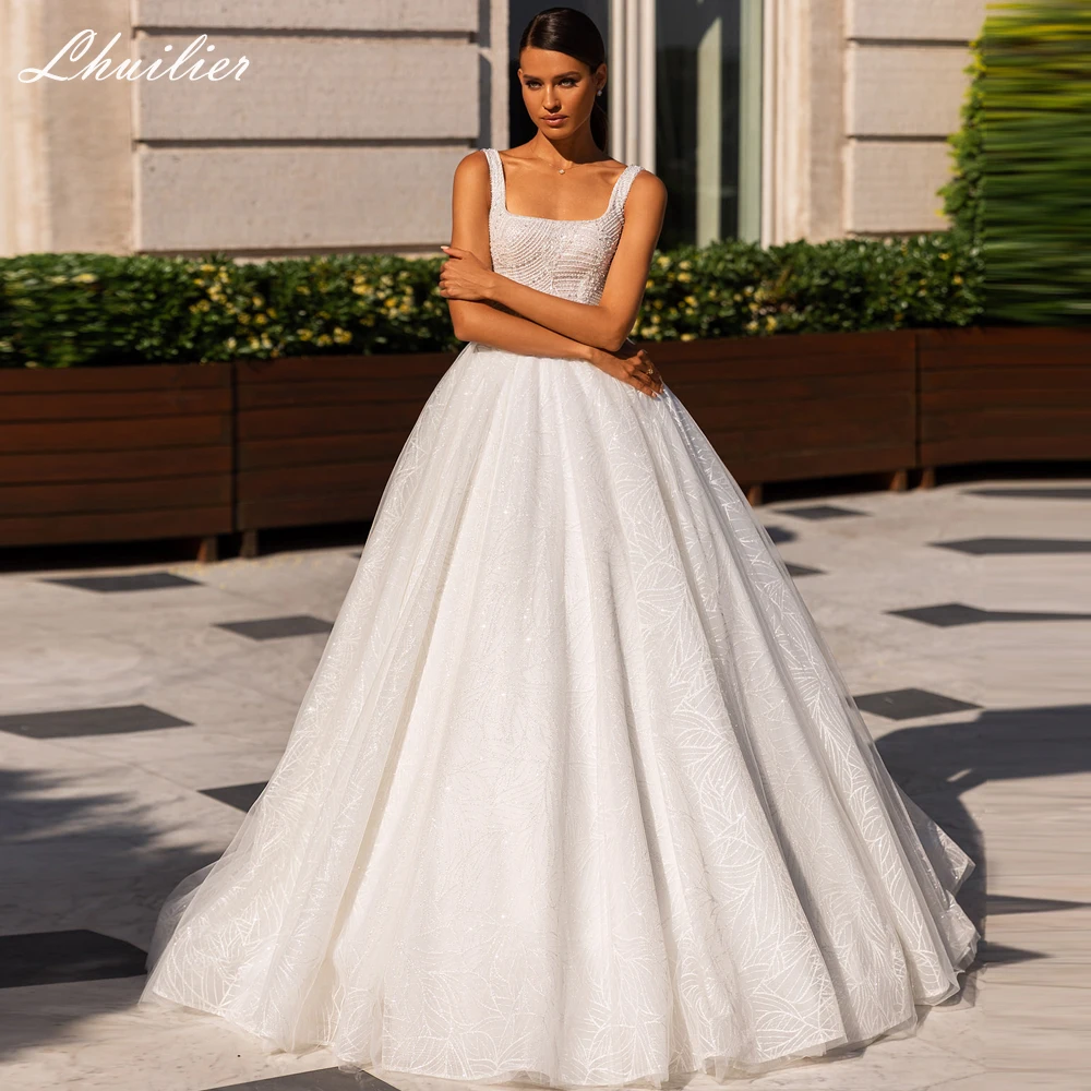 Роскошные свадебные платья-трапеции Lhuilier с вырезом лодочкой, кружевное свадебное платье без рукавов с жемчугом и бисером, блестящее Тюлевое свадебное платье со шлейфом
Роскошные свадебные платья-трапеции Lhuilier с вырезом лодочкой, кружевное свадебное платье без рукавов с жемчугом и бисером, блестящее Тюлевое свадебное платье со шлейфом