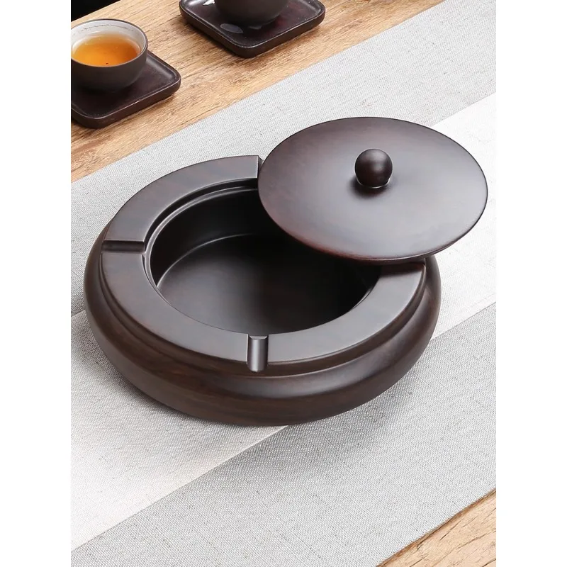 Chinese ashtray male creative personality trend multifunctional household Nordic living room large ebony solid wood with cover.
Chinese ashtray male creative personality trend multifunctional household Nordic living room large ebony solid wood with cover.