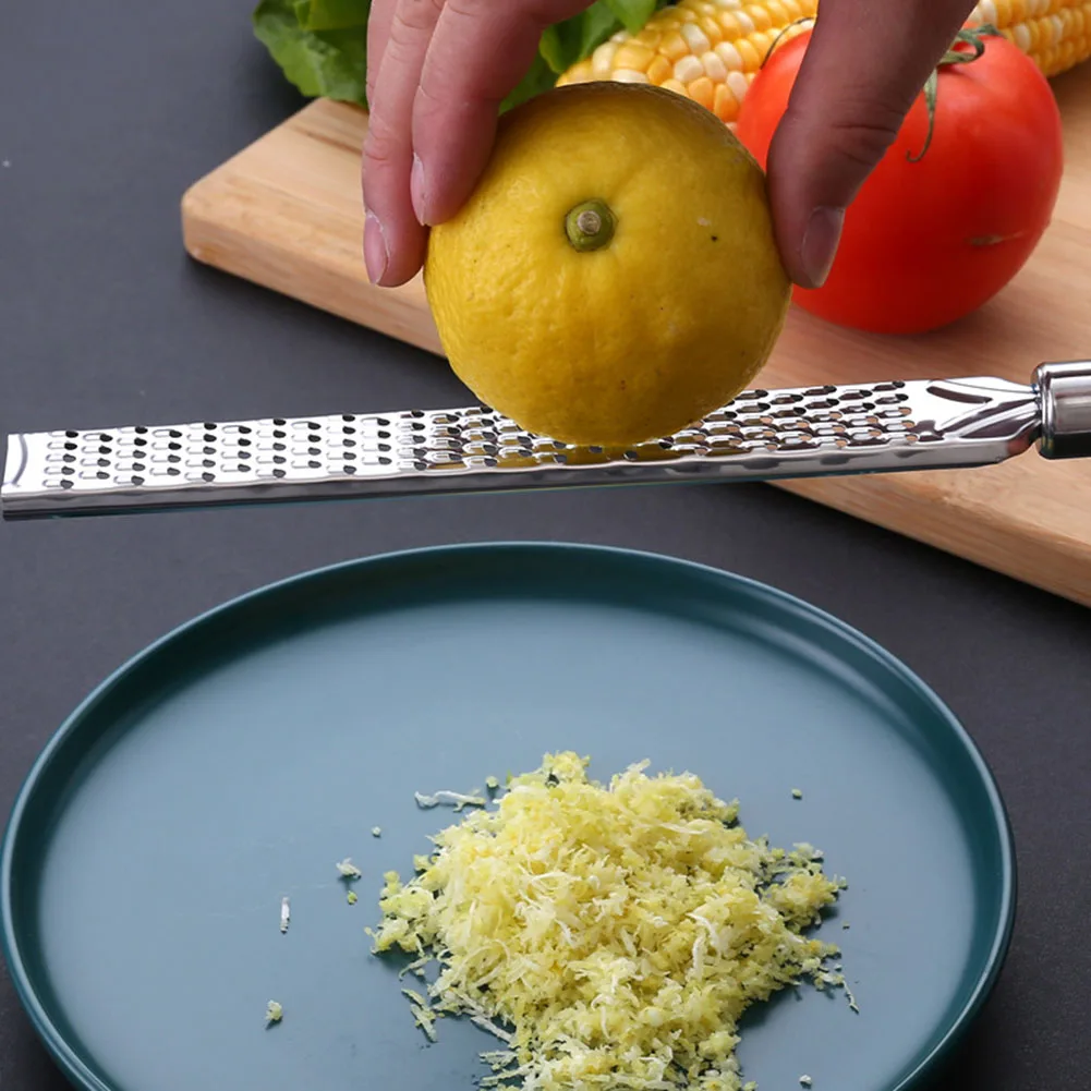 Kitchen Grater Lemon Cheese Spices Stainless Steel Grater Fruit Peeler Ginger Garlic Long Chocolate Multifunctional Gadgets
Kitchen Grater Lemon Cheese Spices Stainless Steel Grater Fruit Peeler Ginger Garlic Long Chocolate Multifunctional Gadgets