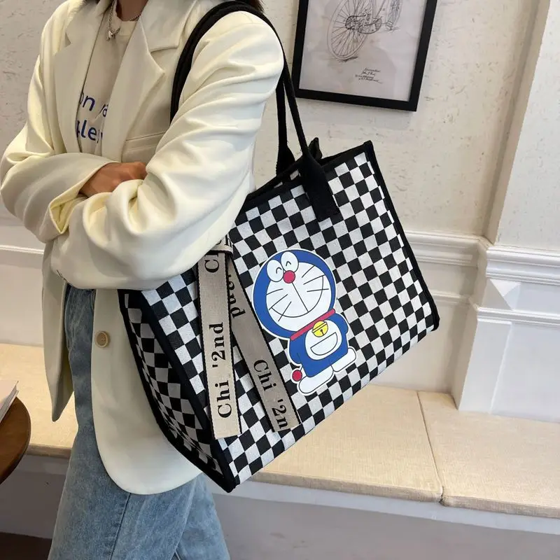 Doraemon Fashion Retro Shoulder Bag Student Large Capacity Handbag Female Cartoon Black and White Lattice Shoulder Bag Tote Bag
Doraemon Fashion Retro Shoulder Bag Student Large Capacity Handbag Female Cartoon Black and White Lattice Shoulder Bag Tote Bag