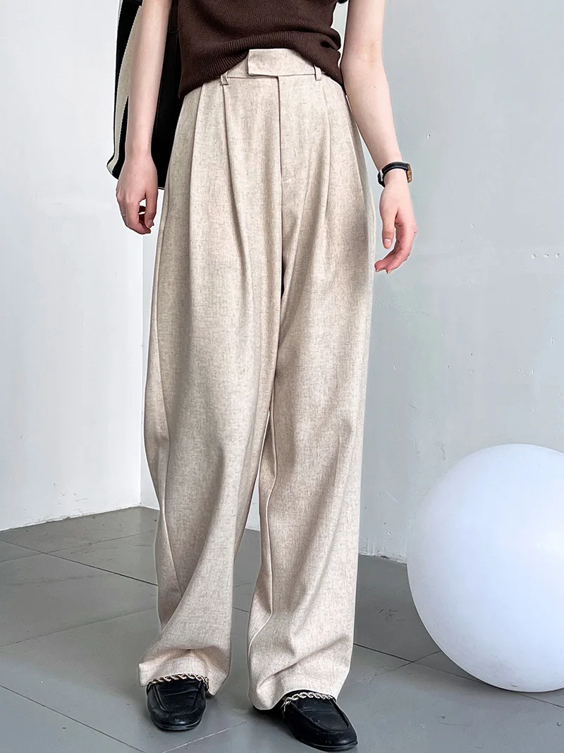 

Minimalist Vintage-Inspired Flowy Wide-Leg Pants Trousers for Women. Autumn Perfect for Office Wear with Loose High-Waisted Fit.