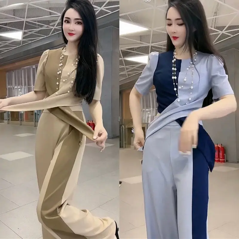 Fashion Suit Women 2022 Summer New Style Stitching To Show Thin Short-sleeved + Wide-leg Pants Two-piece Women
Fashion Suit Women 2022 Summer New Style Stitching To Show Thin Short-sleeved + Wide-leg Pants Two-piece Women