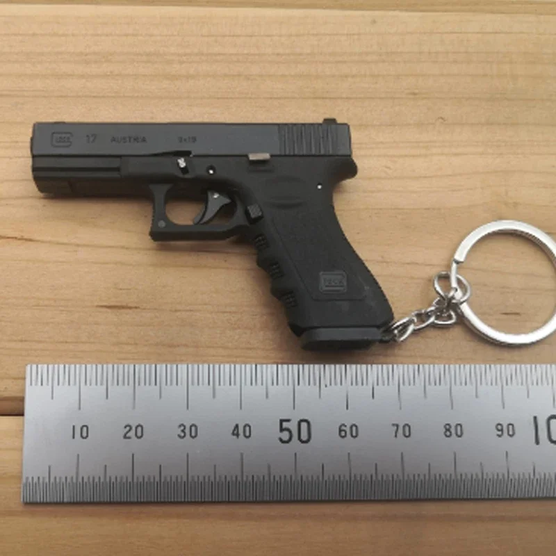 Miniature Toy Gun Keychain PUBG Pistol Model Cartridge Ejection 1:3 Glock Alloy Empire Miniature Toy Gun Keychain for Boys
Miniature Toy Gun Keychain PUBG Pistol Model Cartridge Ejection 1:3 Glock Alloy Empire Miniature Toy Gun Keychain for Boys