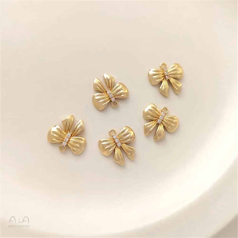 14.5mm 14K gold inlaid zircon pleated bow pendant single pendant diy bracelet earrings jewelry pendant
14.5mm 14K gold inlaid zircon pleated bow pendant single pendant diy bracelet earrings jewelry pendant
