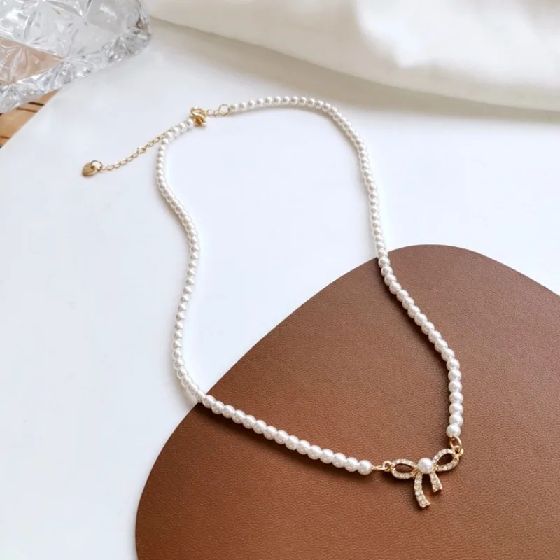 New trend aesthetic bow tie choker with rhinestones trend vintage pearl choker Fine jewelry for woman luxury quality Neck chains
New trend aesthetic bow tie choker with rhinestones trend vintage pearl choker Fine jewelry for woman luxury quality Neck chains