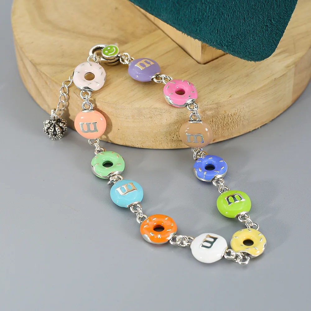 Japanese and Korean fashion doughnut rainbow M bean splicing smiling face button crown chain tail bracelet
Japanese and Korean fashion doughnut rainbow M bean splicing smiling face button crown chain tail bracelet