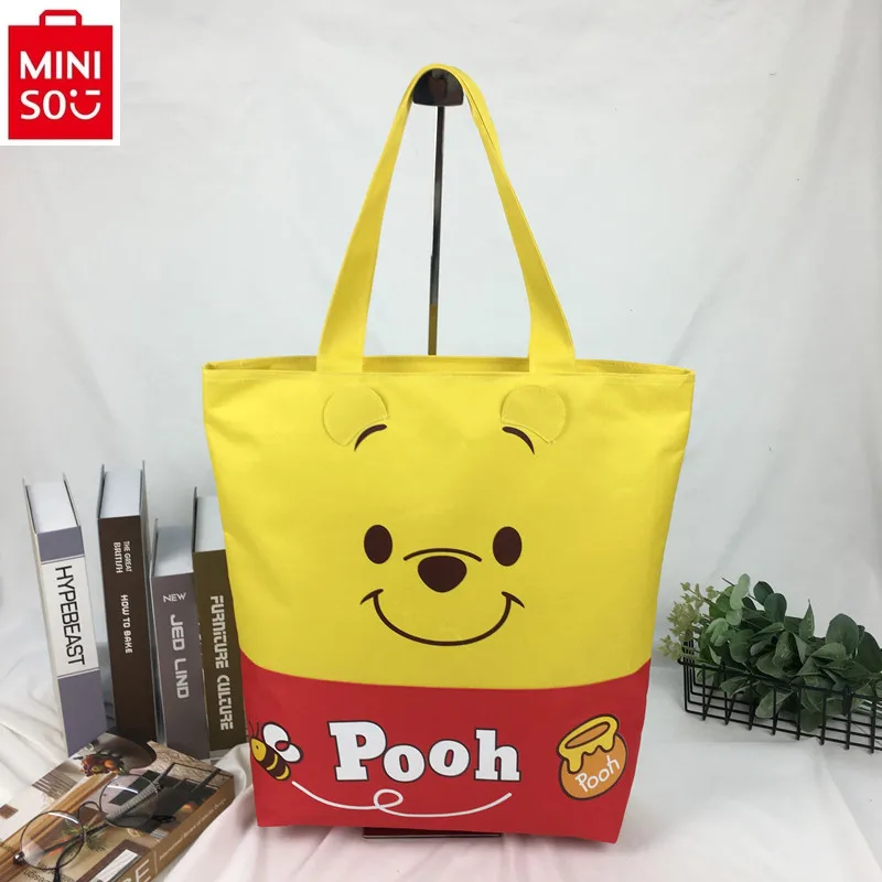 MINISO Disney high-quality canvas casual zipper handbag, women's cute Winnie the Pooh large capacity storage shoulder bag
MINISO Disney high-quality canvas casual zipper handbag, women's cute Winnie the Pooh large capacity storage shoulder bag
