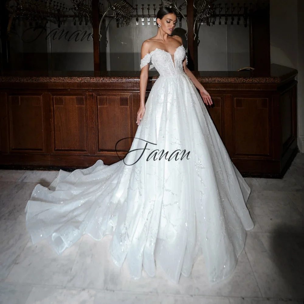 Modern Off Shoulder Bride Dresses Sweep Train Princess Appliques Wedding Gown Glitter A-Line wedding For Women 2022
Modern Off Shoulder Bride Dresses Sweep Train Princess Appliques Wedding Gown Glitter A-Line wedding For Women 2022