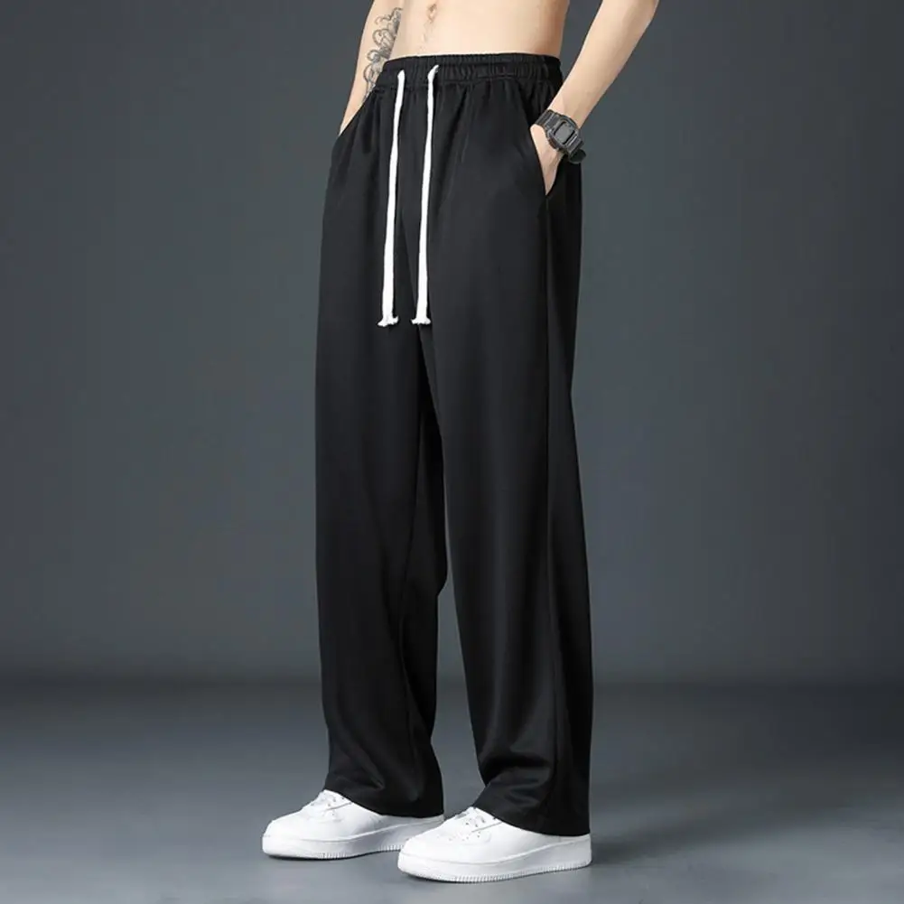 Stretchy Quick-dry Trousers Men's Loose Fit Drawstring Gym Pants with Wide Leg Elastic Waist for Comfortable Training Jogging
Stretchy Quick-dry Trousers Men's Loose Fit Drawstring Gym Pants with Wide Leg Elastic Waist for Comfortable Training Jogging