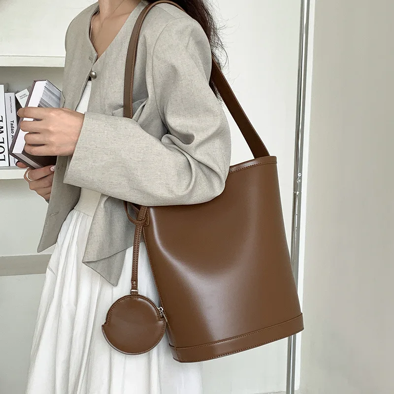 

solid color simple cylinder underarm women's new soft leather senior sense shoulder large capacity commuter bucket bag
