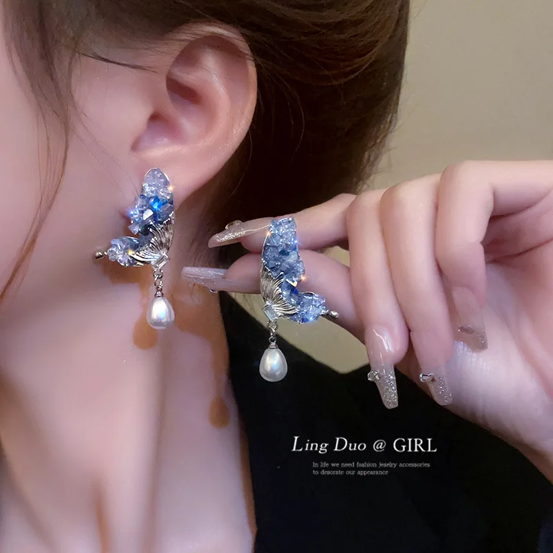 

Super fairy butterfly wings pearl earrings female tide autumn and winter niche design sense advanced earrings luxury temperament