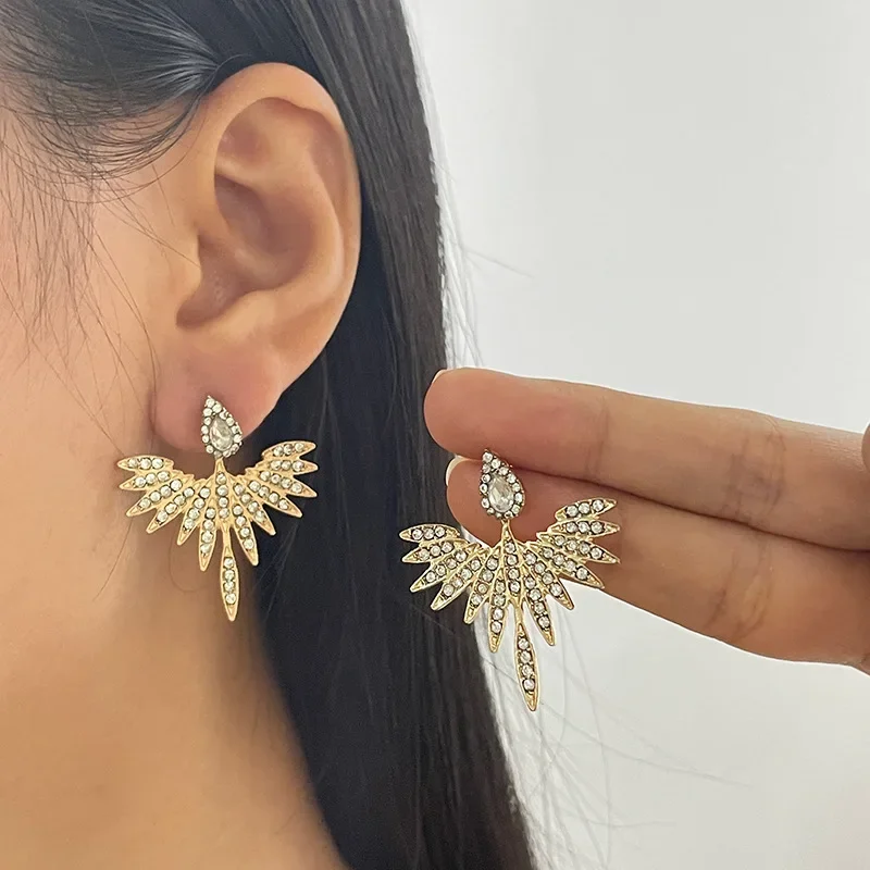 

S925 Silver needle simple European and American exaggerated women's fashion retro senior design sense diamond wing earrings