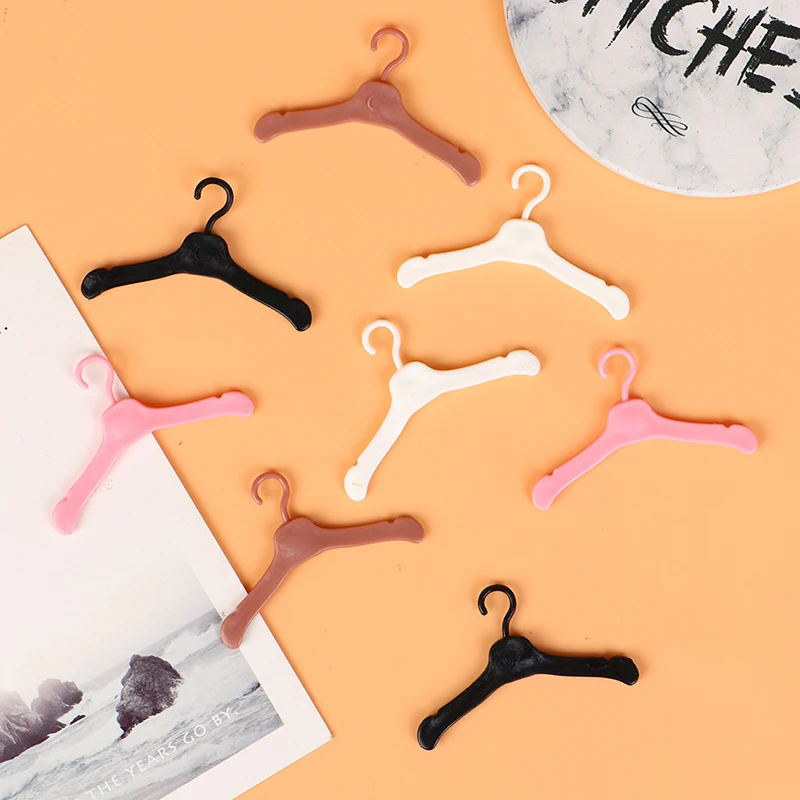 10PCS Lovely Hangers Mini Cute Wardrobe Dress Coat Clothes Plastic Accessories 
10PCS Lovely Hangers Mini Cute Wardrobe Dress Coat Clothes Plastic Accessories