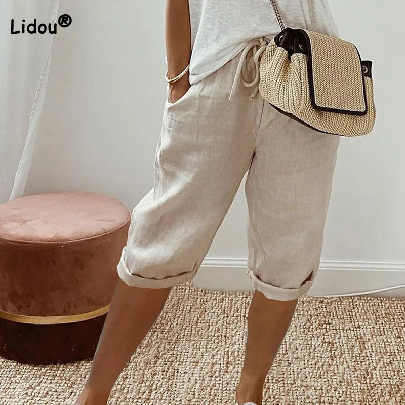 

Fashion Women's Cotton and Linen Pockets Loose Elastic Mid Waist Trousers Summer Drawstring Solid Color Casual Five Cent Pants
