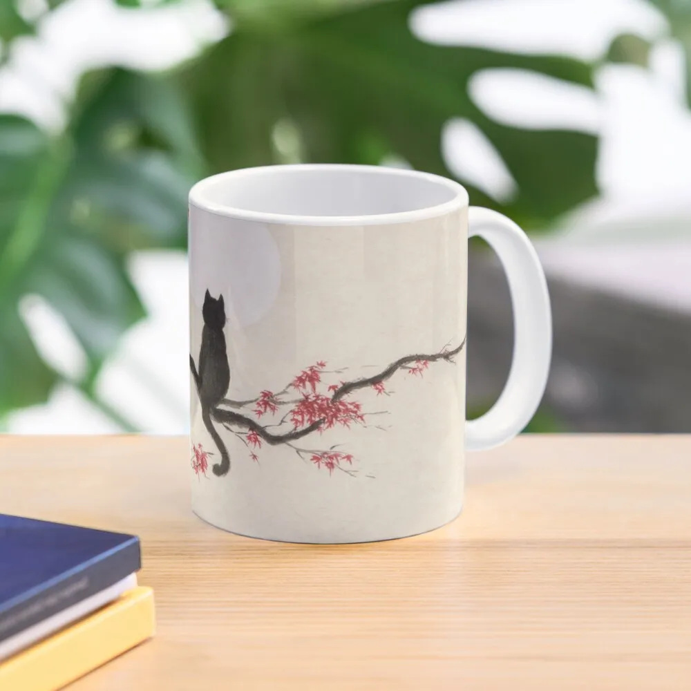 Painting of a black cat sitting on maple tree with red autumn leaves gazing at the full moon art print Coffee Mug
Painting of a black cat sitting on maple tree with red autumn leaves gazing at the full moon art print Coffee Mug